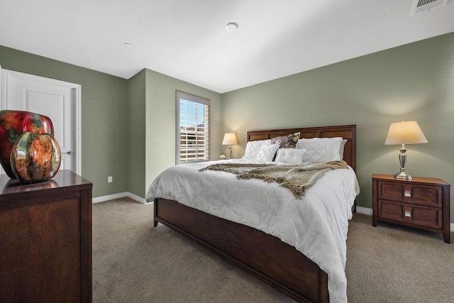 bedroom with light colored carpet