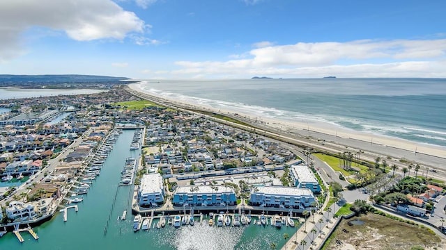 birds eye view of property featuring a water view and a view of the beach