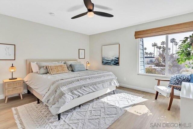 bedroom featuring light hardwood / wood-style flooring and ceiling fan