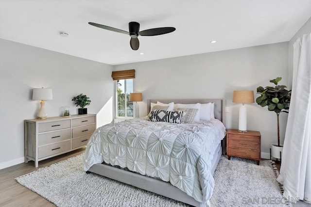 bedroom featuring light hardwood / wood-style flooring and ceiling fan