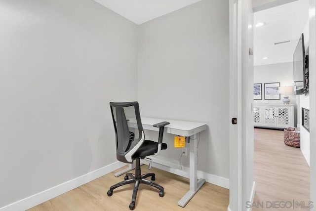 office area with hardwood / wood-style floors