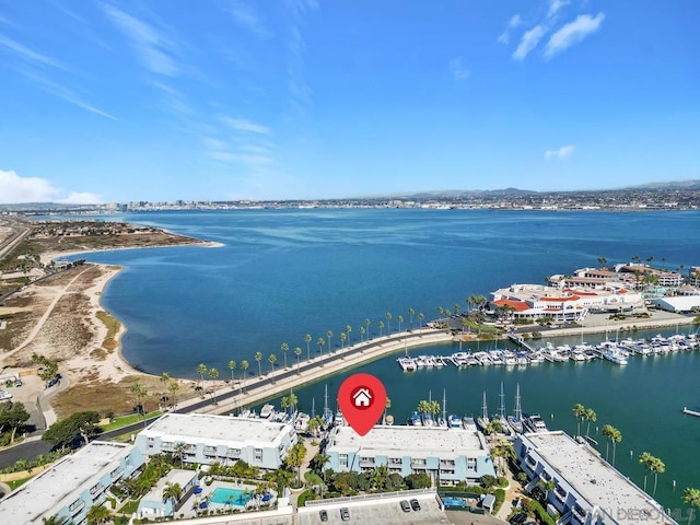 birds eye view of property featuring a water view