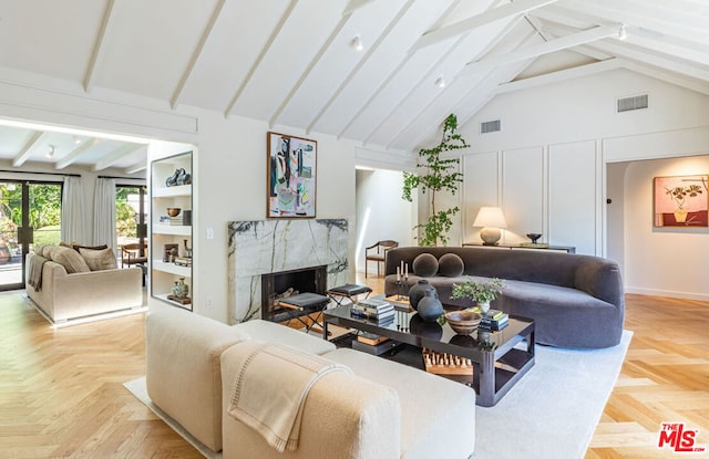 living room featuring beam ceiling, a fireplace, high vaulted ceiling, and light parquet floors