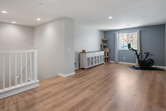 workout area featuring light wood-type flooring