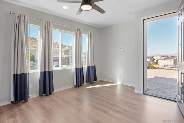 entryway with ceiling fan and light wood-type flooring