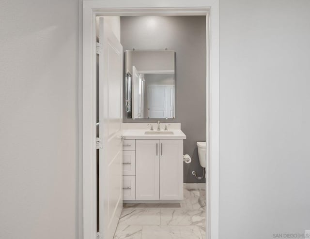 bathroom with vanity and toilet