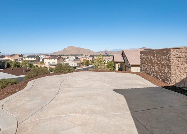 view of patio / terrace featuring a mountain view