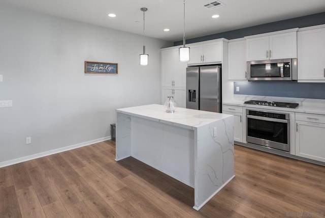 kitchen featuring a center island, white cabinets, and appliances with stainless steel finishes