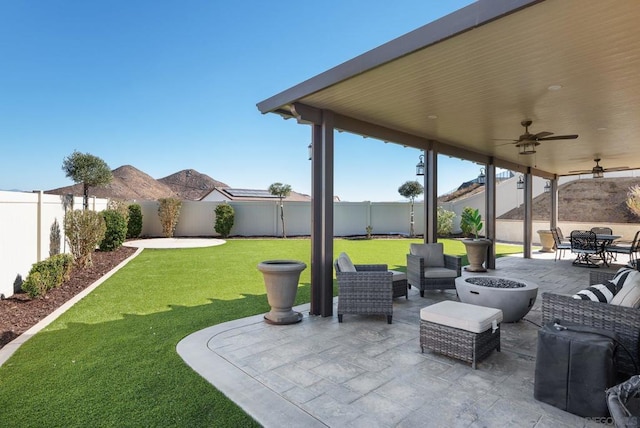 view of patio featuring ceiling fan and an outdoor living space