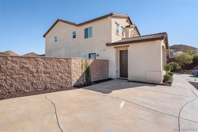 back of property with a patio area