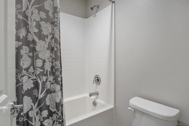 bathroom with toilet and shower / bathtub combination with curtain