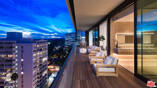 view of balcony at dusk