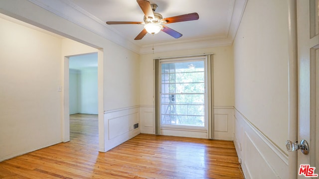 unfurnished room featuring crown molding, ceiling fan, and light wood-type flooring