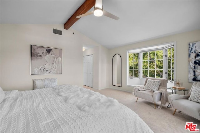 bedroom with light carpet, vaulted ceiling with beams, a closet, and ceiling fan