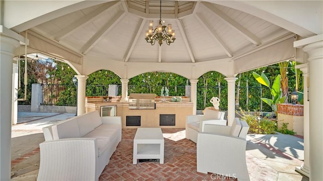 view of patio featuring a gazebo, a grill, exterior kitchen, and outdoor lounge area