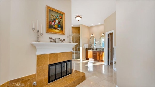 bathroom featuring vanity and a tile fireplace