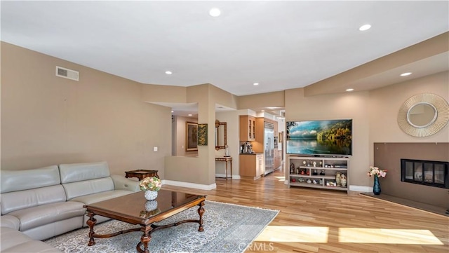 living room with light hardwood / wood-style flooring