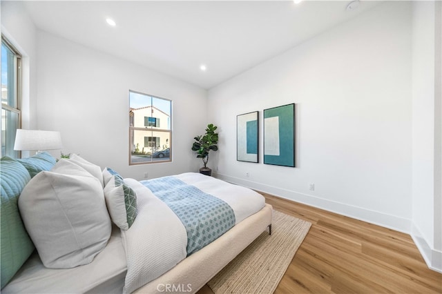 bedroom with wood-type flooring