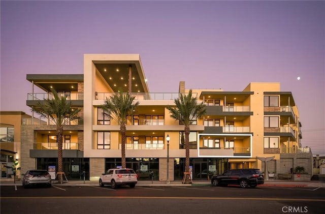 view of outdoor building at dusk