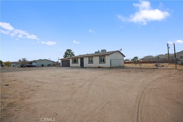 single story home featuring a garage