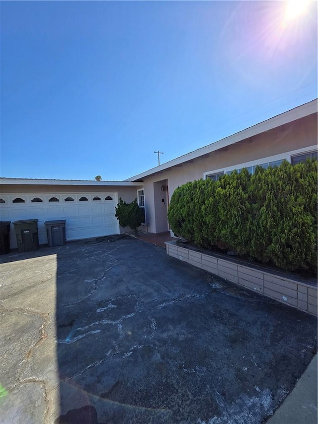 single story home featuring a garage