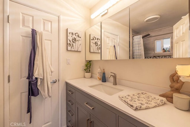 bathroom featuring vanity and a shower with shower curtain