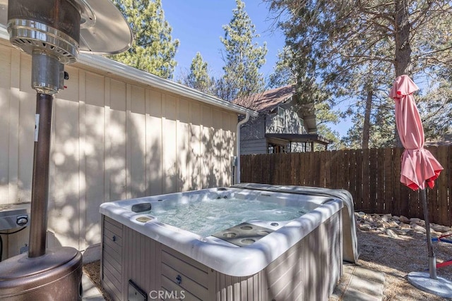 exterior space featuring a hot tub