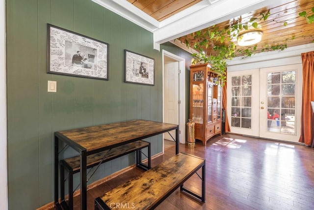 dining room featuring french doors, hardwood / wood-style flooring, and crown molding