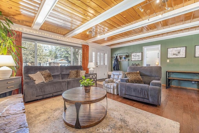 living room with beamed ceiling, hardwood / wood-style floors, and wooden ceiling