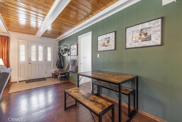 entryway with hardwood / wood-style floors, beam ceiling, and wooden ceiling