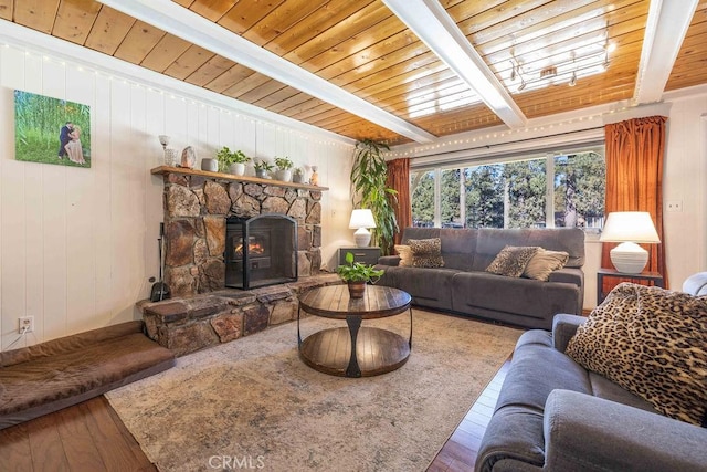 living room featuring wood ceiling, beamed ceiling, and wood-type flooring