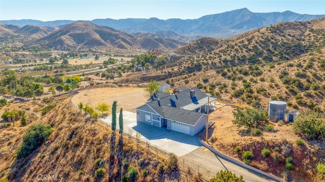 birds eye view of property with a mountain view