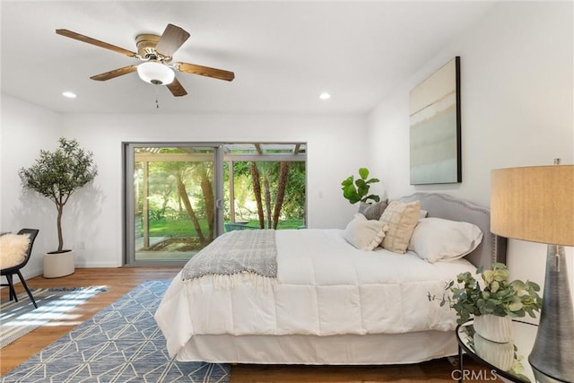 bedroom with access to outside, ceiling fan, and wood-type flooring