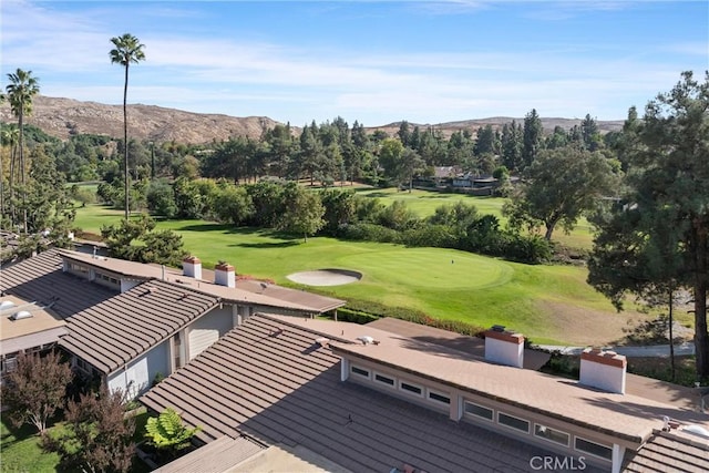 birds eye view of property with a mountain view