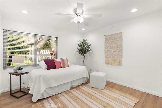 bedroom with hardwood / wood-style floors and ceiling fan