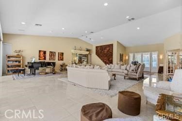 living room featuring vaulted ceiling