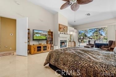 bedroom featuring ceiling fan and vaulted ceiling