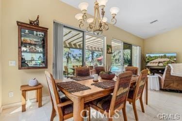 dining area featuring a chandelier