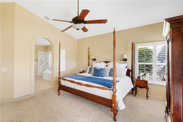 carpeted bedroom featuring connected bathroom, ceiling fan, and lofted ceiling