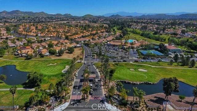 drone / aerial view with a water and mountain view