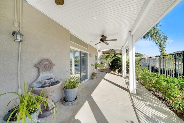 view of patio featuring ceiling fan