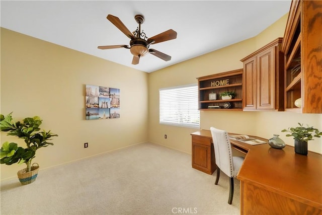 office area featuring light colored carpet and ceiling fan