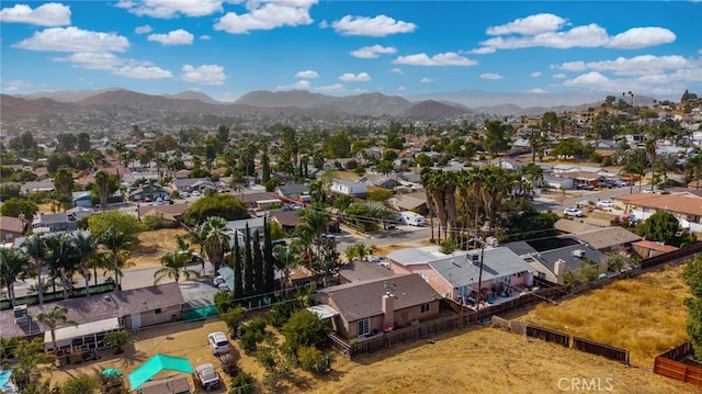 birds eye view of property with a mountain view