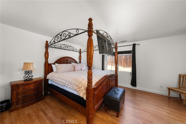 bedroom with light hardwood / wood-style flooring