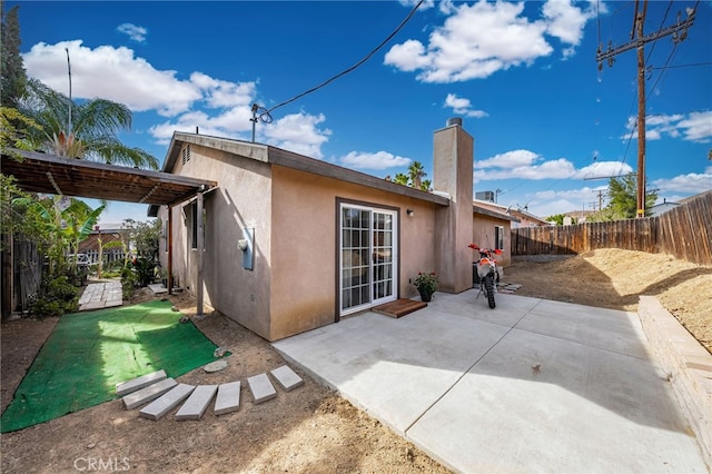 rear view of property featuring a patio