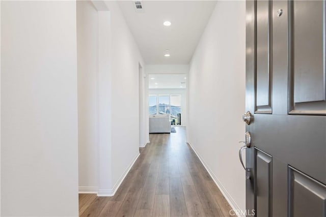 corridor featuring light hardwood / wood-style flooring