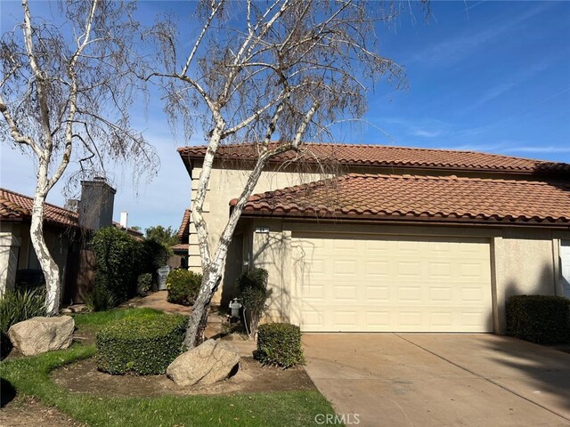 view of property exterior featuring a garage