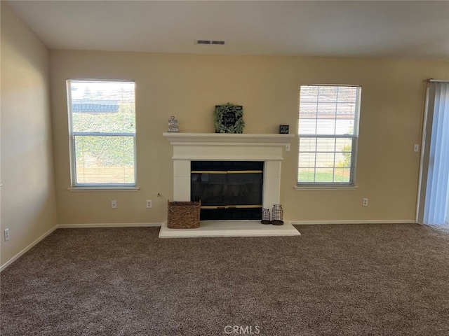 unfurnished living room with carpet