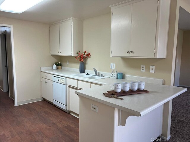 kitchen featuring a breakfast bar, dark wood-type flooring, white dishwasher, kitchen peninsula, and white cabinetry