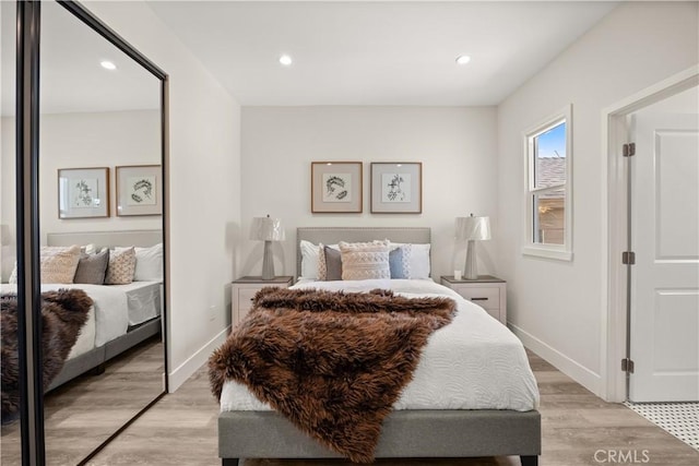 bedroom featuring light hardwood / wood-style floors